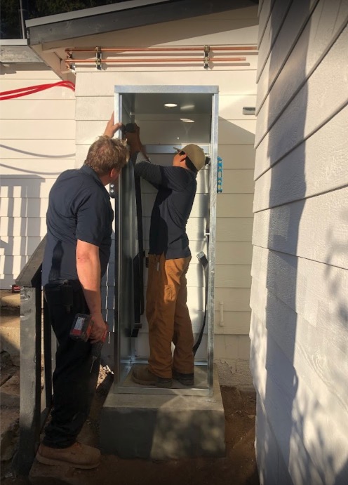 Emergency plumber fixing burst pipe